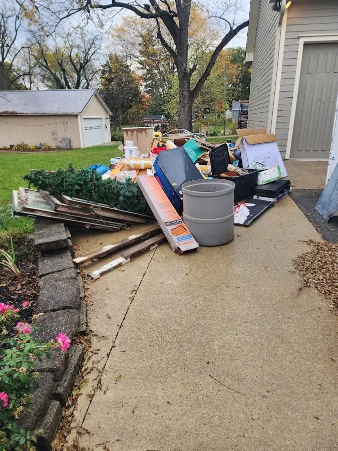 Dumpster being loaded with debris for Commercial Dumpster Rental in Camp Verde